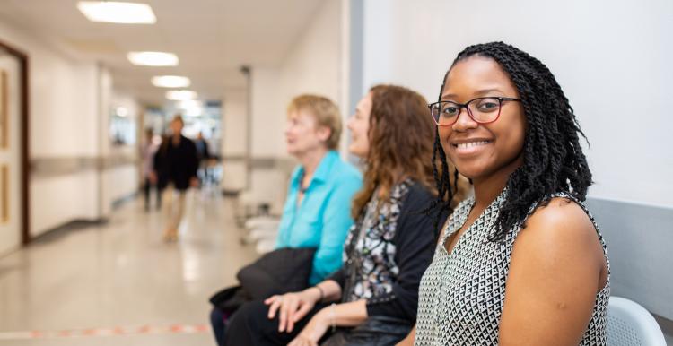 people sitting in a hospital corridor