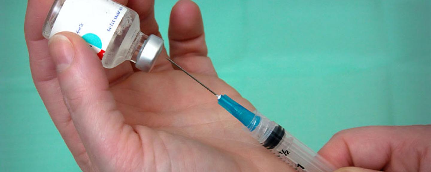 image of needle and vaccine