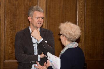 man and woman at board meeting