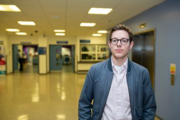 Picture of a young man in a hallway