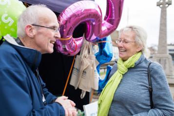 Two elderly people talking