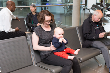 Photograph of people sitting in a health centre waiting area