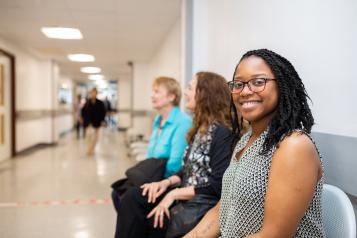 people sitting in a hospital corridor