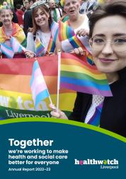 Front cover of the Healthwatch Liverpool Annual Report 2022-23. A Healthwatch Liverpool staff member is taking a selfie while holding a pride flag and trans pride flag in front of colleagues and volunteers holding a larger Healthwatch Liverpool Pride Flag at Liverpool Pride 2022